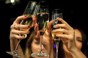 People with champagne in a bar or casino having lots of fun