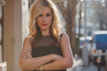Fototapeta premium Beautiful young blonde woman in the city