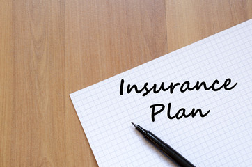 Insurance plan write on notebook