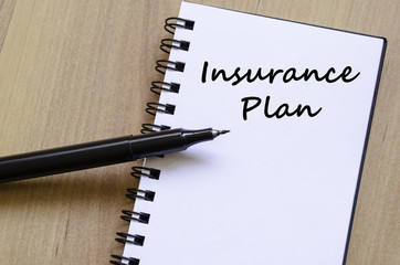 Insurance plan write on notebook