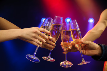 People with champagne in a bar or casino having lots of fun