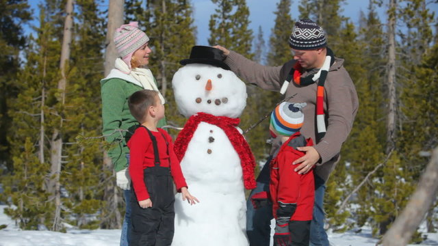 Family building snowman