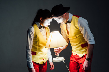  two funny mimes isolated on gray background