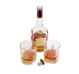 Bottle of whiskey and two glasses with whiskey