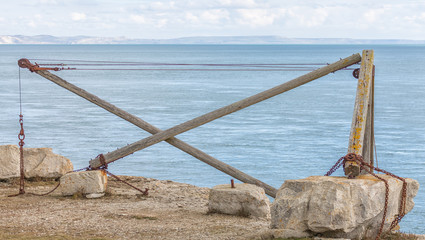 A vintage hand crane at Sandholes on the Isle of Portland originally used by fishermen to move their boats in and out of the sea. 