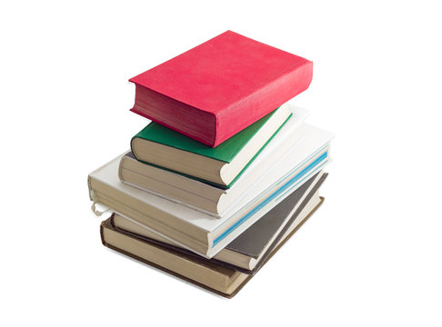 Stack of several different books on a light background