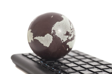 Earth on keyboard isolated on white
