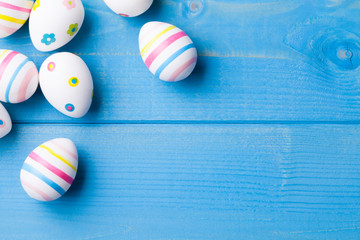 Happy easter eggs on wooden background