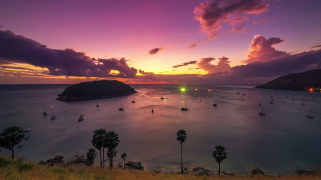 4K TimeLapse. Sunset on the background Island and many yachts in the sea at Phuket Island, Thailand. January, 2016.