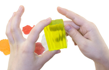 kids hands with handmade color pieces of soap isolated on a white background