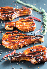 Grilled pork ribs on the wooden background