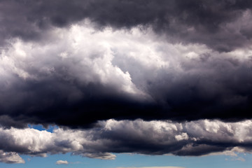 Dark sky with small white clouds