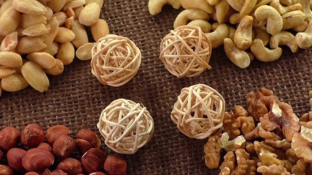 Almonds, cashew, walnuts and hazelnuts lying on burlap 

