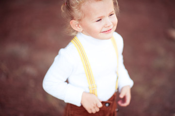 Smiling kid girl 4-5 year old closeup. Happy child. Childhood.