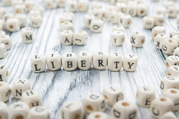 The word Liberty written wood block. Wooden ABC