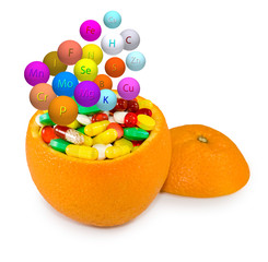 Isolated image of pills inside orange