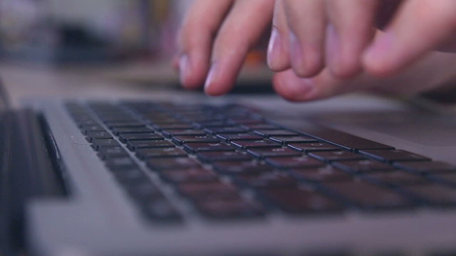 Hands typing on tablet financial information. HD.