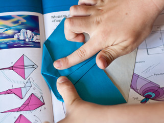 Fold a paper airplane