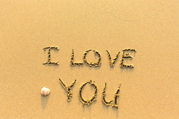 I Love You - inscription on sand beach.