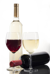 Red and white wine bottles with glasses