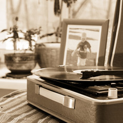 The vintage player of vinyl records with a retro toning