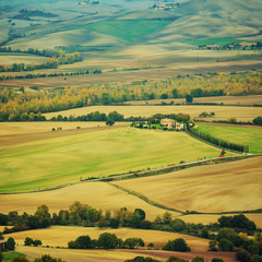 Wavy fields in Tuscany at sunset, Italy. Natural outdoor seasonal spring background.
