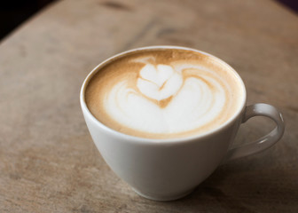 cup of coffee on wooden table