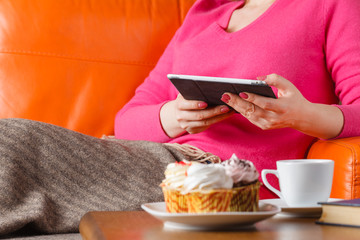 Woman work on table and drink tea
