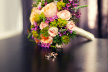 wedding rings and bridal bouquet