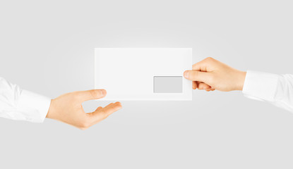 White blank envelope giving hand. Envelope mockup design.