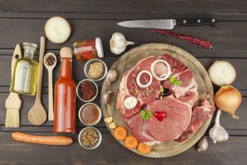 Raw beef shin and vegetables. Sales of beef. Preparing meat for cooking. Raw meat on a cutting board ready for cutting. Preparing the menu.
