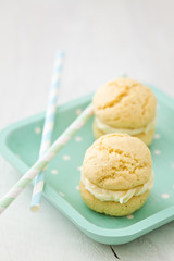 Vanilla whoopie pies with buttercream filling on tray