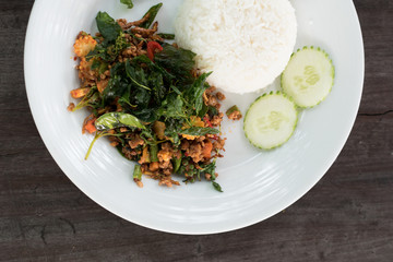 spicy stir fry pork minced with herb , Thai food