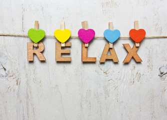 Word relax of wooden letters on a white background