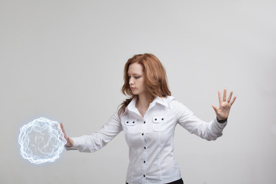 Woman with glowing magical energy ball.