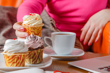 Woman drink tea and eat sweets