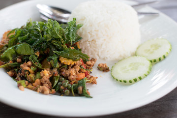 spicy stir fry pork minced with herb , Thai food