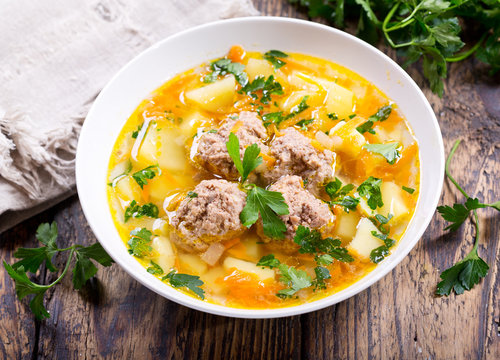 plate of soup with meatballs