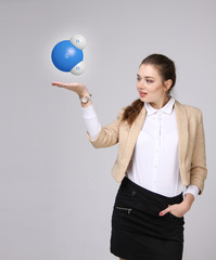 Young woman scientist with model of water molecule.