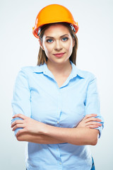 Smiling woman architect standing against white background