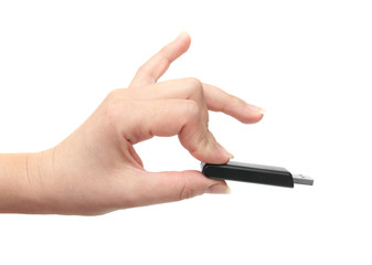 flash drive in a female hand isolated on the white