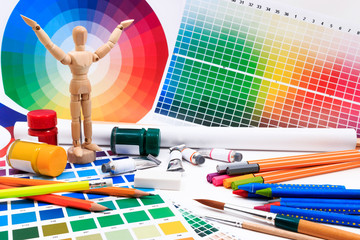 A set of tools for creative art work with abstract colored palette guide.