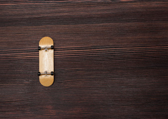 fingerboard on a wooden background