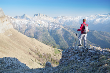 Fototapeta premium Man staring at the mountains.