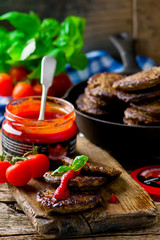 fritters from a liver with tomato sauce