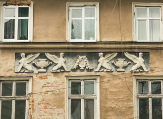 Fototapeta na wymiar Facade with decorative stucco. Lviv, Ukraine. European travel photo.