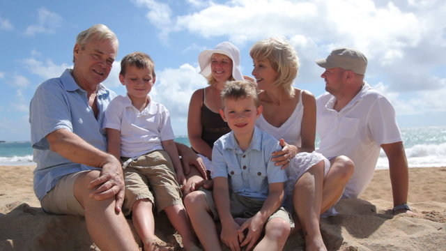 Portrait of multi-generation family at beach together