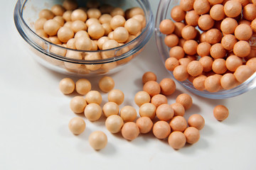 ball powder in the round package on white background