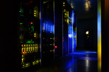 server room in dark, with bright colored lights