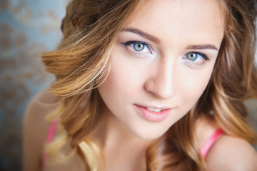 Portrait of a beautiful young bride preparing for wedding in a morning